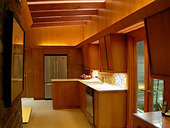 mid century modern kitchen with dramatic lighting
